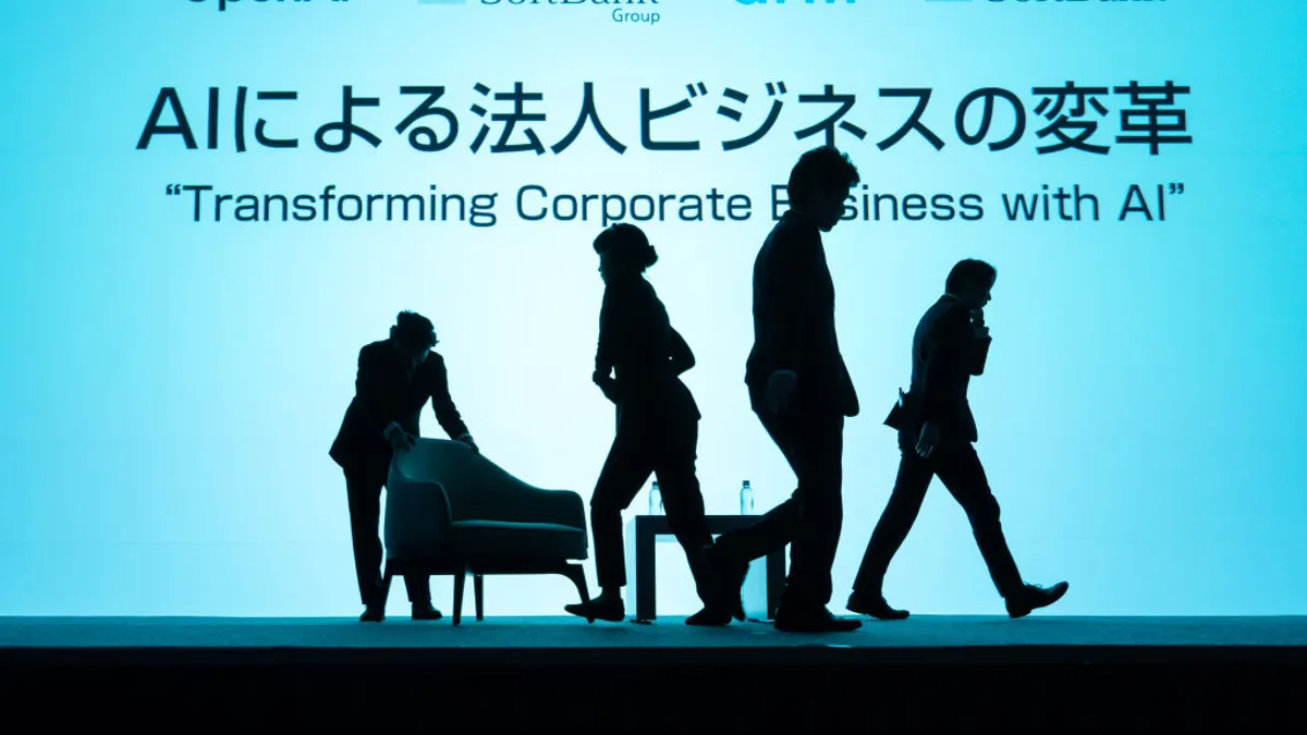 AIによる企業変革をテーマにしたイベント会場を準備するスタッフ